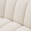 A luscious fluted contemporary sofa with boucle upholstery