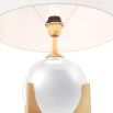 A luxurious crystal glass table lamp with a brushed brass base