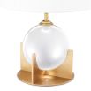 A luxurious crystal glass table lamp with a brushed brass base