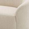 A sophisticated, curvaceous and asymmetric natural linen sofa by Eichholtz 