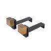 A luxury set of andirons by Eichholtz which feature vintage brass blocks and a black finish
