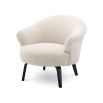 A luxurious boucle cream upholstered chair by Eichholtz with a curved silhouette and black bentwood legs