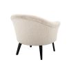 A luxurious boucle cream upholstered chair by Eichholtz with a curved silhouette and black bentwood legs