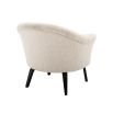 A luxurious boucle cream upholstered chair by Eichholtz with a curved silhouette and black bentwood legs