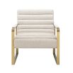 A luxurious boucle upholstered armchair with a brushed brass base