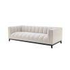 A cosy and luxurious boucle cream sofa with a contrasting black finish base by Eichholtz 