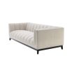 A cosy and luxurious boucle cream sofa with a contrasting black finish base by Eichholtz 