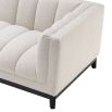 A cosy and luxurious boucle cream sofa with a contrasting black finish base by Eichholtz 