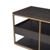 A fabulous dark brown tv unit with three drawers and brass frame accents