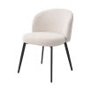 A beautiful set of dining chairs with a stunning boucle cream upholstery and black tapered legs 