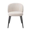 A beautiful set of dining chairs with a stunning boucle cream upholstery and black tapered legs 