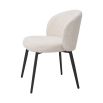 A beautiful set of dining chairs with a stunning boucle cream upholstery and black tapered legs 