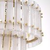 A luxurious, two-tiered Eichholtz chandelier with a frosted glass and brass finish