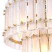 A luxurious, two-tiered Eichholtz chandelier with a frosted glass and brass finish