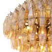 A gorgeous diamond shaped chandelier with antiqued brass and gold glass.