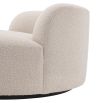 A luxurious round sofa by Eichholtz with a dreamy boucle cream upholstery and a sleek black base