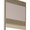 A unique wall mirror by Eichholtz with a brushed brass frame and smoked mirrored glass finish 