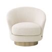 A luxury swivel chair by Eichholtz with a Pausa Natural upholstery and brushed brass base