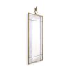 Gorgeous, antiqued wall mirror with ornamental top and brass frame