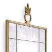 Gorgeous, antiqued wall mirror with ornamental top and brass frame