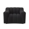 A sumptuous and sophisticated black boucle armchair