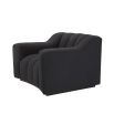 A sumptuous and sophisticated black boucle armchair