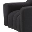 A sumptuous and sophisticated black boucle armchair