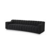 A stunning deep-channelled black boucle sofa