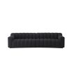 A stunning deep-channelled black boucle sofa