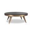 A luxury coffee table by Eichholtz with a bevelled black glass top and brushed brass finish 