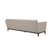 A Mid-Century inspired sofa by Eichholtz with a luxurious beige upholstery, tufting, curved armrests and a sleek black base