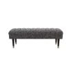A large contemporary cannon black ottoman bench by Eichholtz 