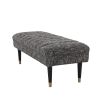 A large contemporary cannon black ottoman bench by Eichholtz 