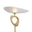 Asymmetrical floor lamp on a marble bass with an abstract brass ornament.