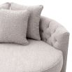 A stylish love seat by Eichholtz with a Bouclé grey upholstery, deep-buttoned backrest and three scatter cushions