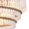 A spectacular, Art Deco chandelier by Eichholtz with five tiers, an antique brass finish and clear glass tubes