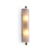 A delicate frosted glass wall lamp with antique brass details