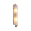 A delicate frosted glass wall lamp with antique brass details