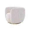 A curvaceous swivel by Eichholtz with a Lyssa Off-White fabric upholstery and a glamorous brushed brass swivel base