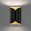 A chic black and gold wall lamp