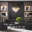 A glamorous art deco chandelier with brass accents by Eichholtz