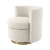 A glamorous boucle cream armchair with a brass swivel base