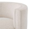 A beautifully curved, swivel chair in a gorgeous off-white fabric.
