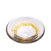 Handblown glass bowl with a yellow swirl.