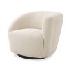 A stylish swivel chair with an asymmetric back upholstered in a natural linen fabric mounted on a black base 