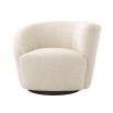 A stylish swivel chair with an asymmetric back upholstered in a natural linen fabric mounted on a black base 