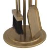 A luxury fire tool set by Eichholtz with a vintage brass finish