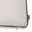 A contemporary canvas outdoor cushion with black piping by Eichholtz