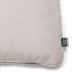 A luxury outdoor cushion by Eichholtz with an off-white canvas cover 