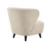 A luxury chair by Eichholtz with a dreamy upholstery and contrasting black feet